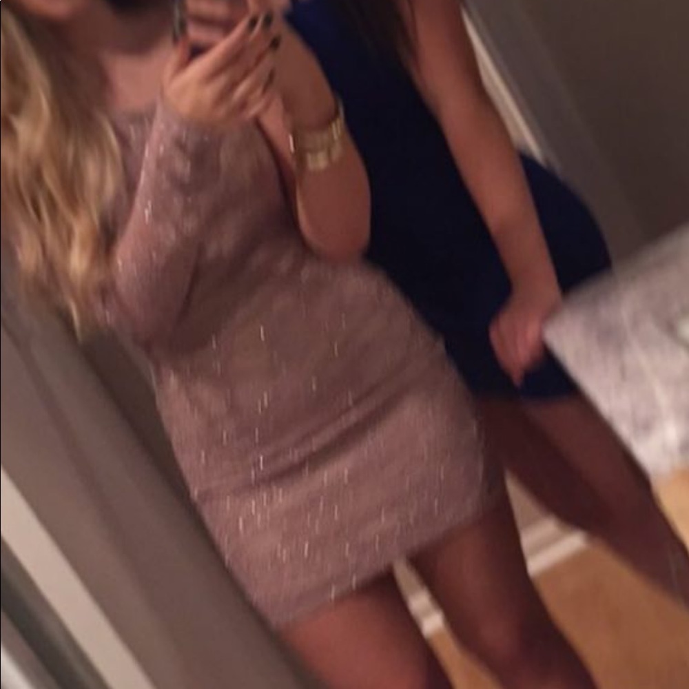 One sleeved sparkly mini dress